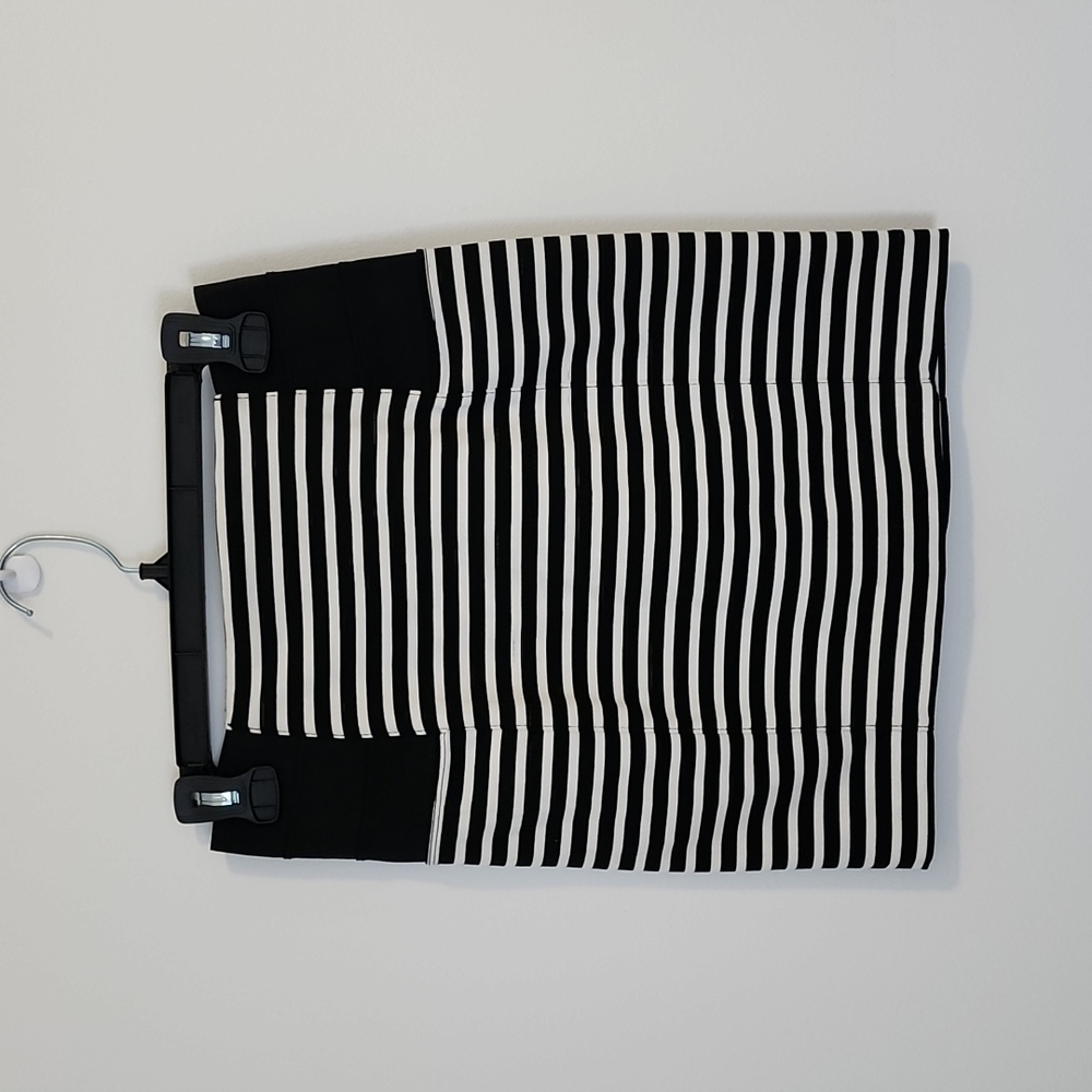 Dynamite, small. Mini skirt, just above the knee. Black & white Stripes.